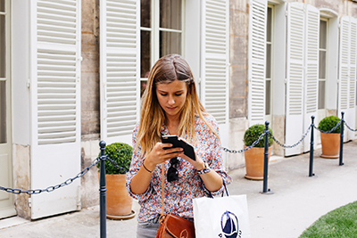 Girl purchasing a product from her smartphone.